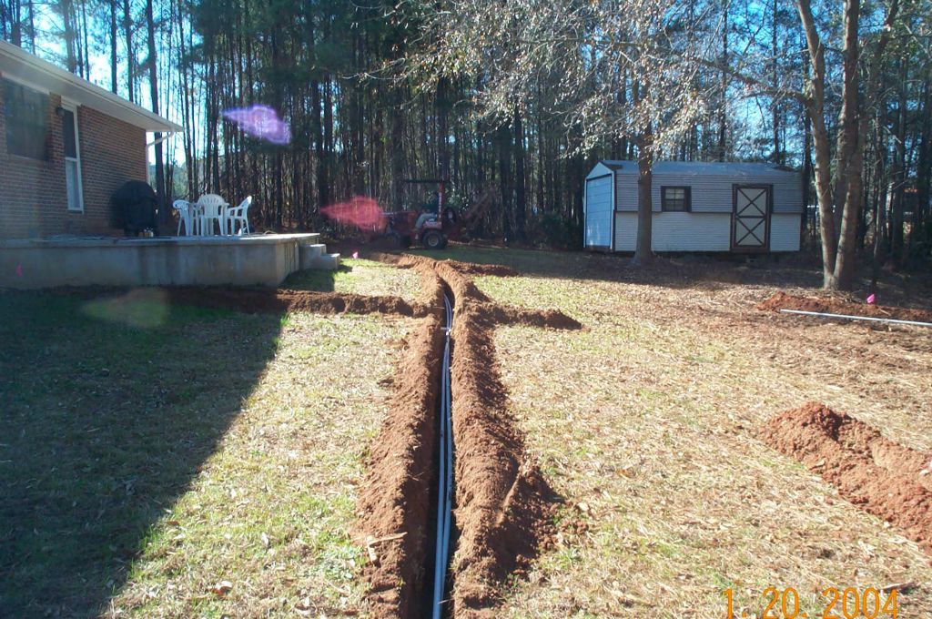 Precision drip irrigation component installed around foundation plantings in Milledgeville