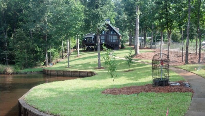 Freshly planted garden area with mulch and ornamental shrubs at a Milledgeville residence